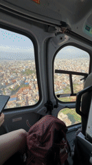 Helicopter flies over Kageshwori Manohara, Nepal in clear weather