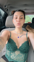 Woman takes selfies in car in Bulgarian village