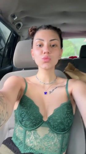 Woman takes selfies in car in Bulgarian village
