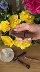 Beauty products showcased with flower arrangements during afternoon demonstrations