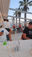 Tourist documents dining experience in Kuşadası restaurant