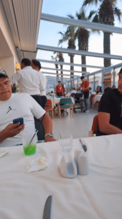 Tourist documents dining experience in Kuşadası restaurant