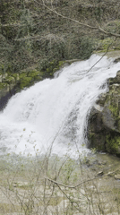 Tourist documents waterfalls, cave art, monastery in central Bulgaria