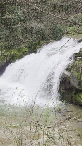 Tourist documents waterfalls, cave art, monastery in central Bulgaria