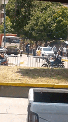 Street scene with motorcycles, people observed in Caracas