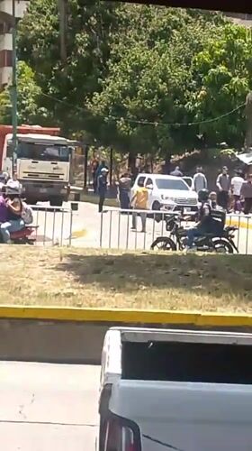 Street scene with motorcycles, people observed in Caracas