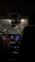 Driver navigates rainy night streets in Saint Petersburg