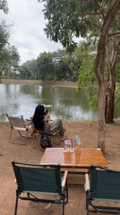Lakeside café scene with ducks on the water, Kuta Selatan