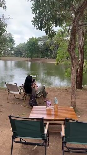 Lakeside café scene with ducks on the water, Kuta Selatan