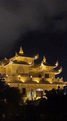 Traditional Asian architecture documented in nighttime Da Lat footage