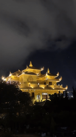 Traditional Asian architecture documented in nighttime Da Lat footage