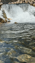 Small waterfall flows into clear pond in Kazan