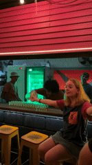 Evening bar scene documented in São Paulo hostel district
