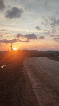 Sunset documented along rural road in Sarapul, Russia