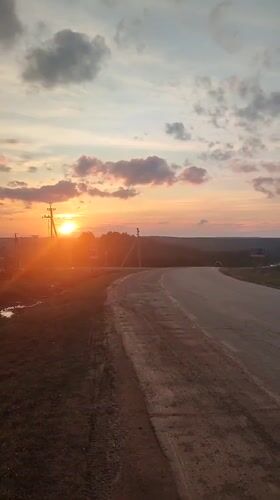 Sunset documented along rural road in Sarapul, Russia