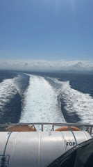 Boat crossing choppy seas near Nusa Penida, Indonesia
