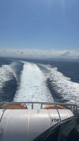 Boat crossing choppy seas near Nusa Penida, Indonesia