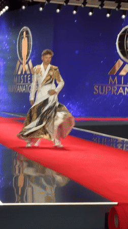 White and gold abstract robe steals the runway in Poland