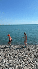 Busy summer beach day on the Sirius, Russia coastline