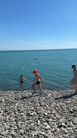 Busy summer beach day on the Sirius, Russia coastline