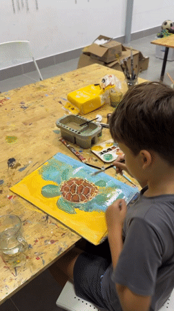Casual art session in Mũi Né with sea turtle paintings in progress