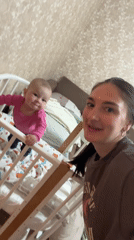 Woman films herself with baby in Sochi bedroom