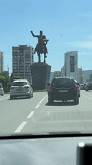 Morning traffic flows around equestrian statue roundabout in Tbilisi