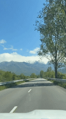 Morning highway drive captured near snow-capped mountains in Bulgaria