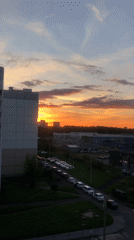 Vivid sunset sky over a Russian apartment block