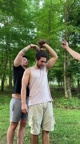Late-night outdoor haircut session in Washington Township woods