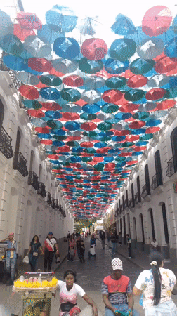 Colorful umbrella installation decorates busy Caracas street