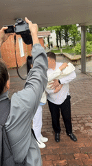 Family photoshoot captured near hospital in rainy Birobidzhan