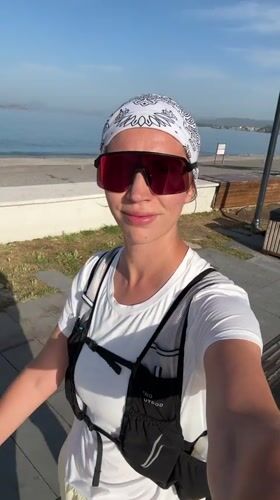 Woman records selfie video in athletic gear in Fethiye