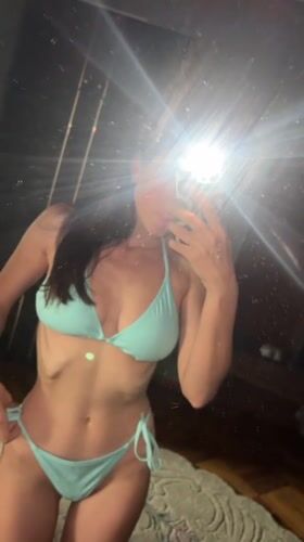 Person takes mirror selfies in bedroom, Kyiv