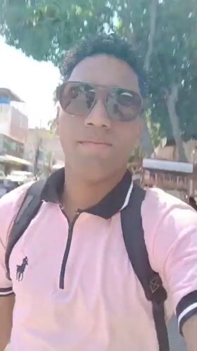 Man films selfie video in busy Porlamar plaza