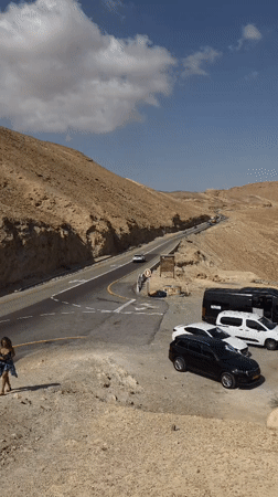 Morning traffic flows through Tamar desert highway near Masada