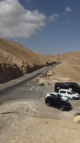 Morning traffic flows through Tamar desert highway near Masada