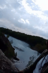 Person observed at scenic overlook amid eroded landscape