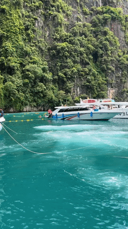 Longtail and speedboats navigate Ao Nang's karst-lined waters