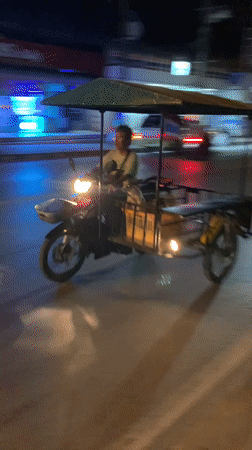 Nighttime tuk-tuk ride through Bang Rak streets