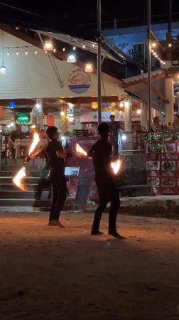 Fire dancers perform coordinated show on Karon Beach