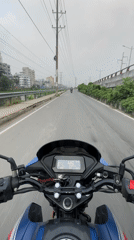 Midnight motorcycle ride through container truck area in Dhaka