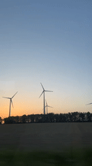 Wind turbines filmed at sunset near Fredenbeck, Germany