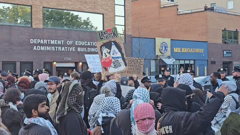 Protesters gather at NYC Education Department building wearing keffiyehs