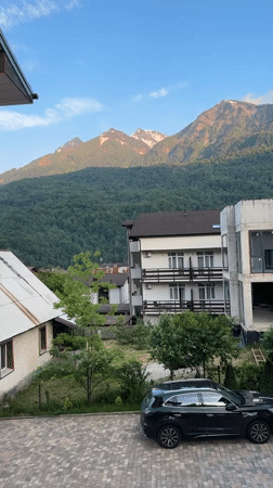 Mountain landscapes and parked SUV observed in Krasnaya Polyana
