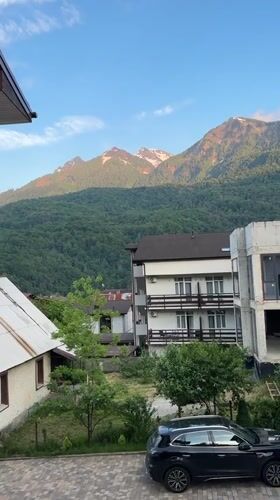 Mountain landscapes and parked SUV observed in Krasnaya Polyana