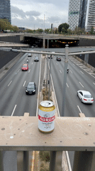 Beer and motorcycle observed from highway overlook in Spain