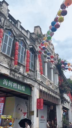 Longhua District's lantern-lit colonial street on a cloudy morning