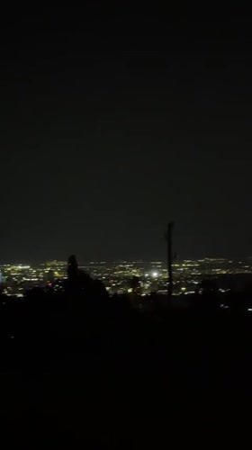 Sofia city lights spread across the night skyline from above