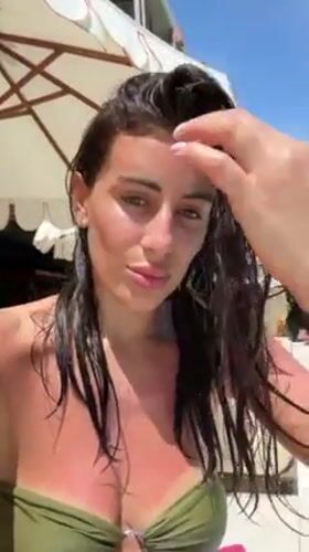 Woman enjoys morning poolside relaxation session in Bali